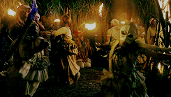 Dancing slaves with torches around a bonfire.