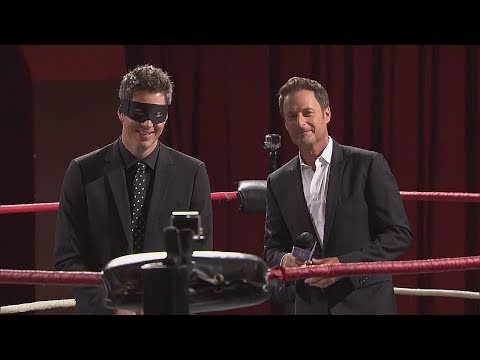 Arie is dressed as "the kissing bandit" in a suit, polka-dotted tie, and domino mask.