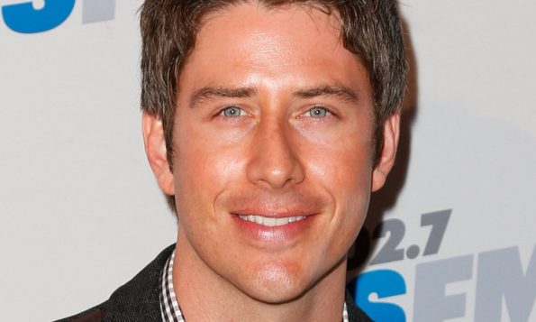 Arie stares blankly at the camera