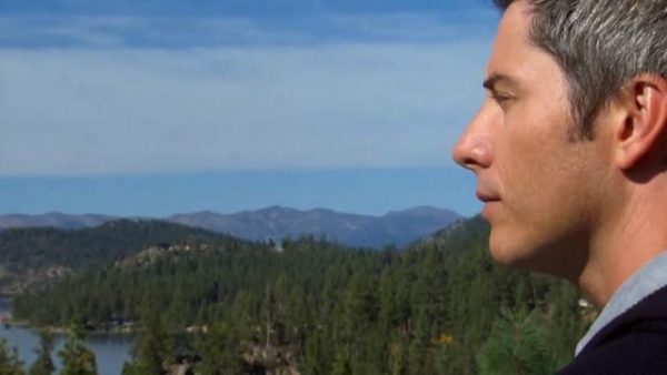A close up of Arie's face as he looks at the mountains or something.