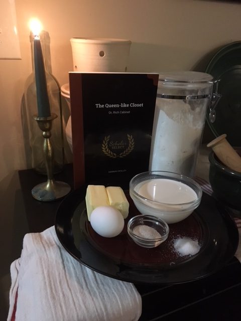 Ingredients picture! Flour, butter, sugar mixture, salt, cream, egg, with the book The Queen Like Closet behind.