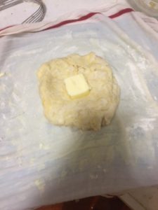 A pat of butter in the middle of the dough.