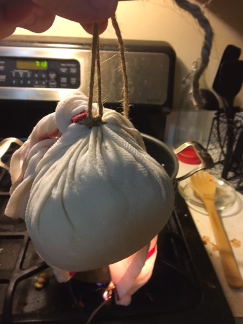 All tied up! Bundle of dough, about the size of a softball, tied with jute cord