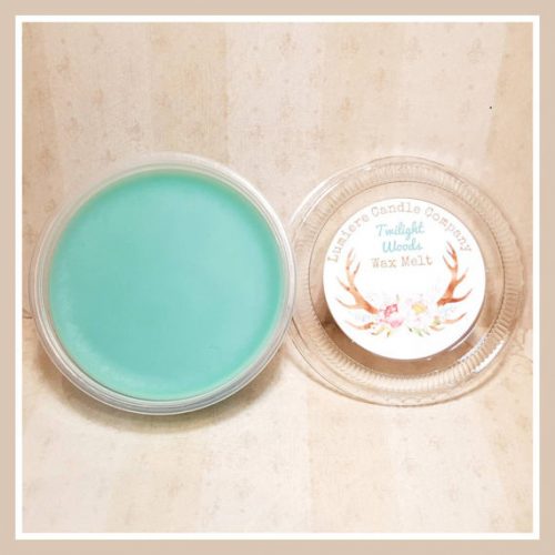 A teal wax melt in a plastic container