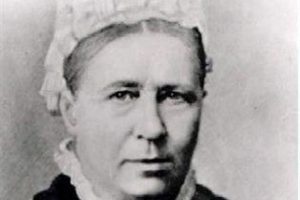 Photo of an older Mary, with a white cap