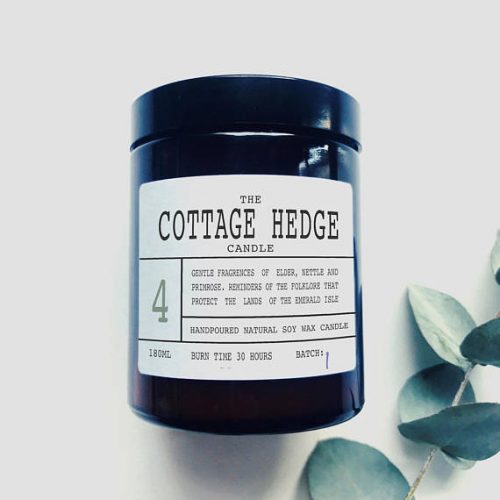 An amber jar with a black lid and a white label.