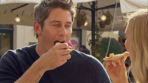 Arie and Lauren eat pizza