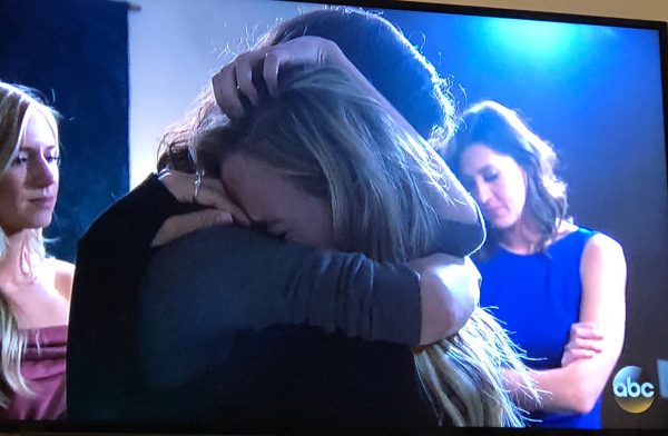 Jacqueline and Kendall hug tightly with genuine emotion and sadness