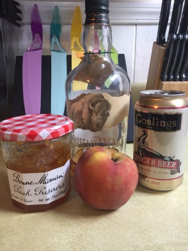 Drink ingredients: peach preserve, bourbon, ginger beer, and a peach