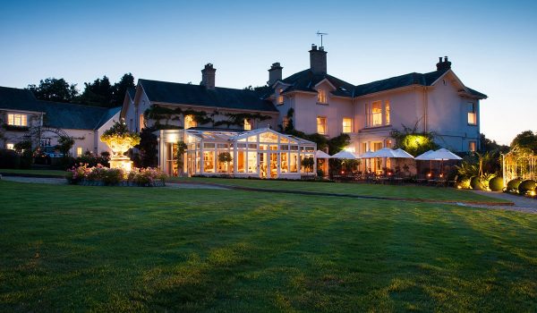 The Lodge at night, lit from within