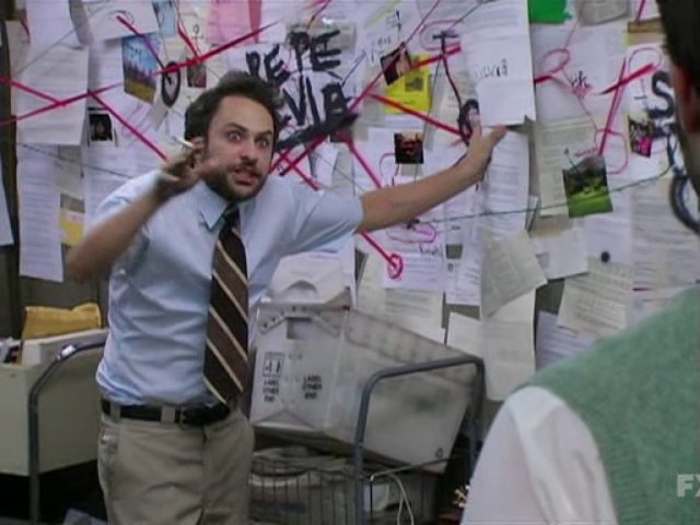 Charlie Day from It's Always Sunny stands in front of his Pepe Silvia conspiracy board