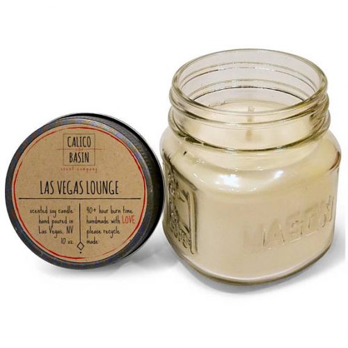Calico Basin Scent Company. Las Vegas Lounge scent gin and tonic candle. An off white candle in a glass mason jar.