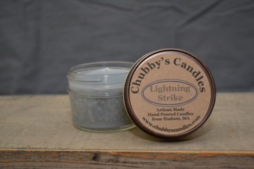 Chubby's Candles Lightning Strike. A light blue candle in a short jar with a parchment-style label.