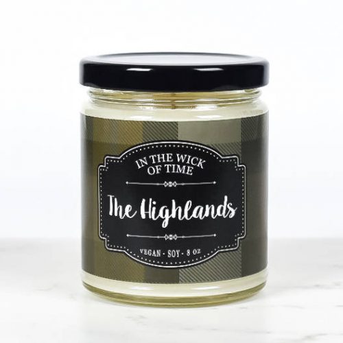 In the Wick of Time Highlands Scented Candle. A white soy candle in a jar with a green plaid label.