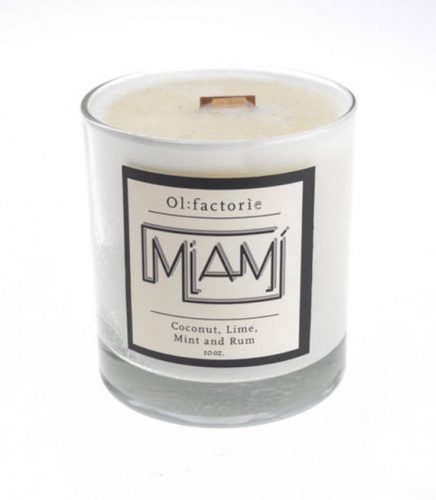 Olfactorie Candles in Miami scent. A white candle in a clear jar. The wick is square and likely to produce a crackling effect.