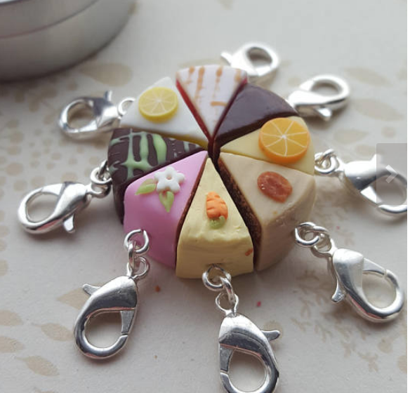 Polymer clay cake stitch minders in multiple flavors