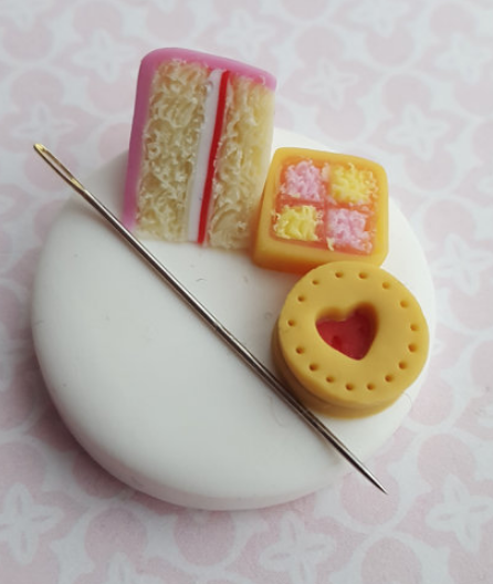 Magnetic needle minder with a cookie, cake and slice of square cake