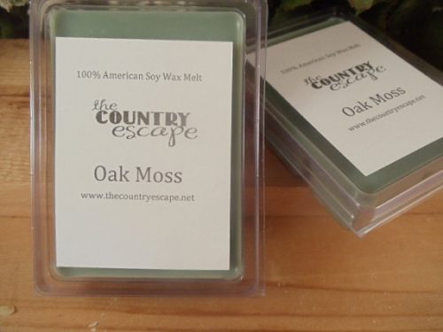 The Country Escape Oak Moss wax melt. Six cubes of a muted green wax to be melted.
