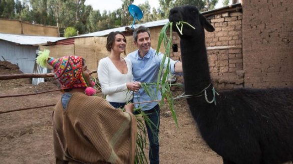 Arie and Becca feed a llama