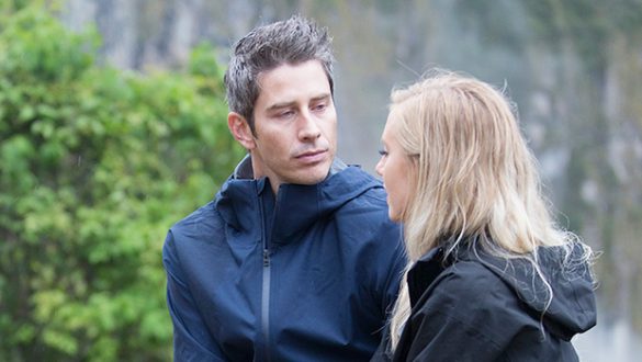 Arie and Lauren walk and talk. It's misty and they are wearing rain coats