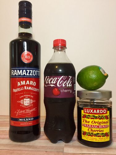 Ingredients for a cherry cola limeade - cherry coke, lime, and Razzamotti Amaro