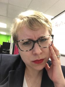 Elyse looking very confused with her head tilted to the left.