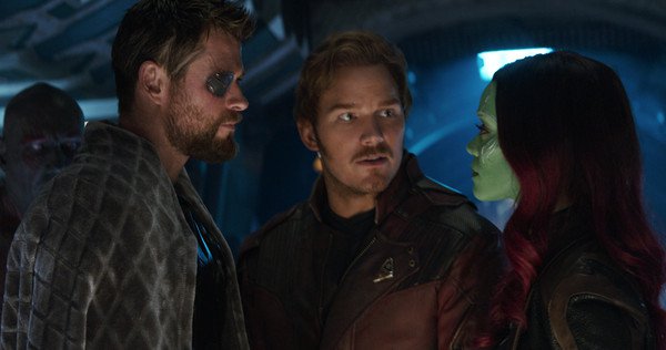Peter Quill stands between Gamora and Thor