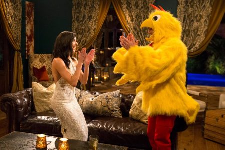 Becca and David who is in a chicken suit do the chicken dance.