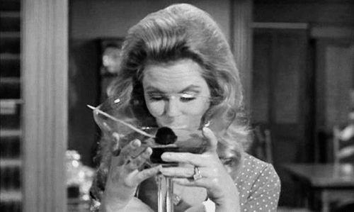 Samantha from Bewitched downs a large gulp from a mammoth martini with her eyes slightly crossed.