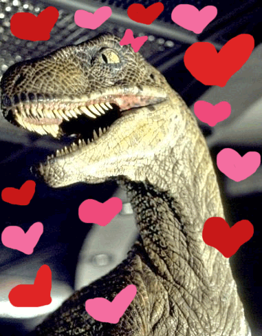A dino with big teeth surrounded by pulsing hearts he loves you a lot, mr dino does!