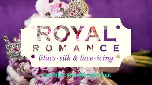 A bright and colorful banner graphic of a crown on top of pink flowers.