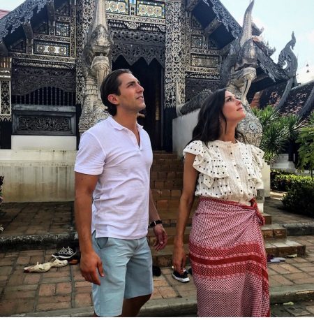 Jason and Becca stand outside a temple
