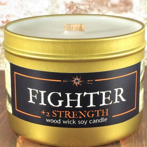 Epic Adventures Candle Fighter RPG scent. A white candle in a gold, metal tin. It has a square wood wick.