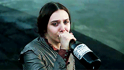 Elizabeth Olsen drinks straight from a wine bottle