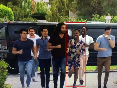 A screenshot of a bunch of dudes getting out of a limo and Wills has on a floral romphim and it's amazing