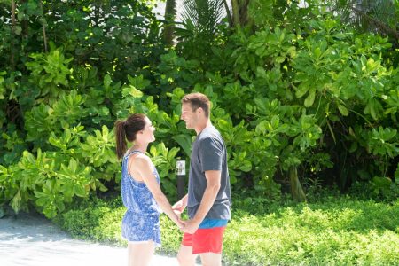 Becca and Garrett hold hands.