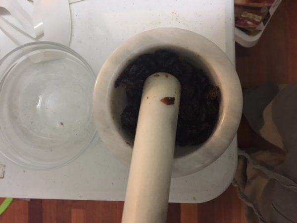 raisin in a marble mortar and pestle