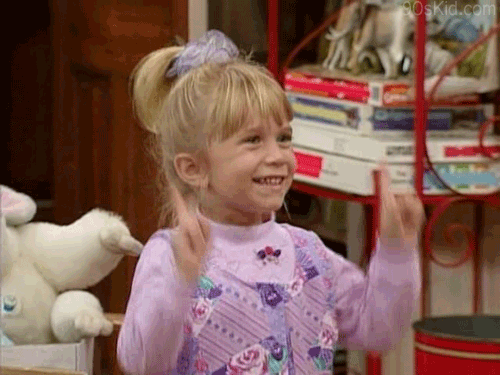 Michelle Tanner from Full House does a little dance. She's got one hell of a scrunchie in her hair. The 90s were great.
