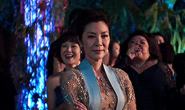 Nick's mother, in her wedding finery, looking disapproving.