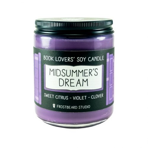 A purple candle in a glass jar with a black metal lid.