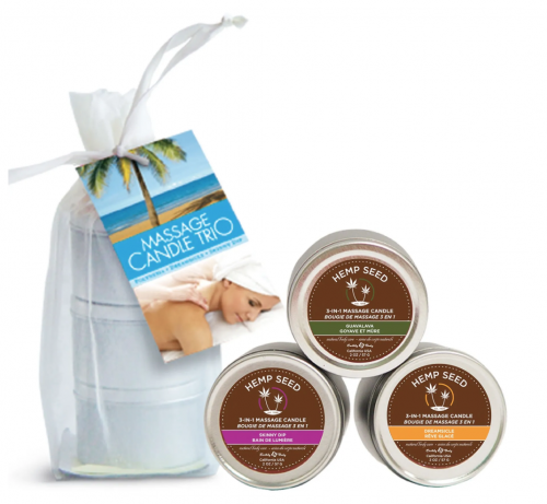 A trio of small candles in metal tins with a white mesh bag for carrying.