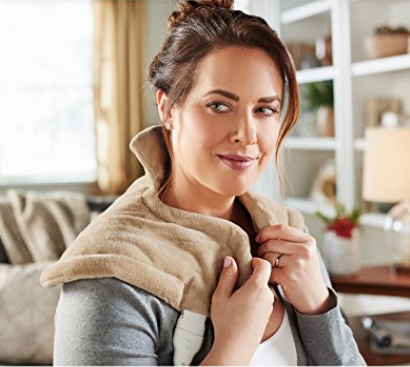 a model holding the neck and shoulder wrap over her shoulders, looking determined like she is going to fight ALL the crime and smash ALL the patriarchy 