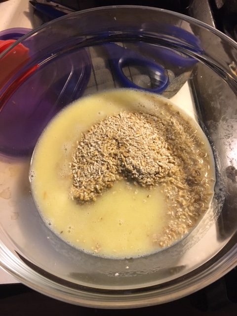 Unground oatmeal and milk and butter solution, before mixing.