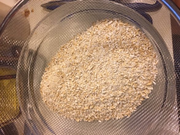 The ground oats being sifted through my sieve. I SIFTED GRAIN FOR YOU PEOPLE