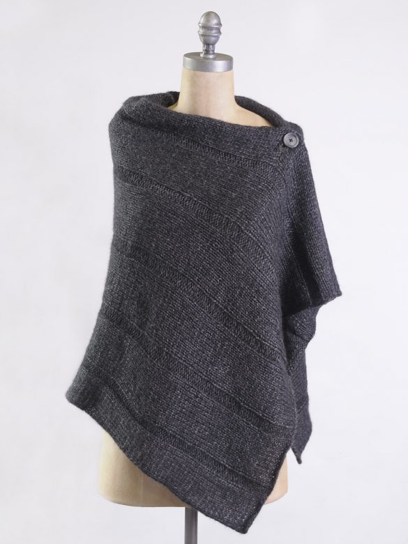 Sasha wrap on mannequin it fastens across the shoulder so the neckline is wide and the knit covers your front and back