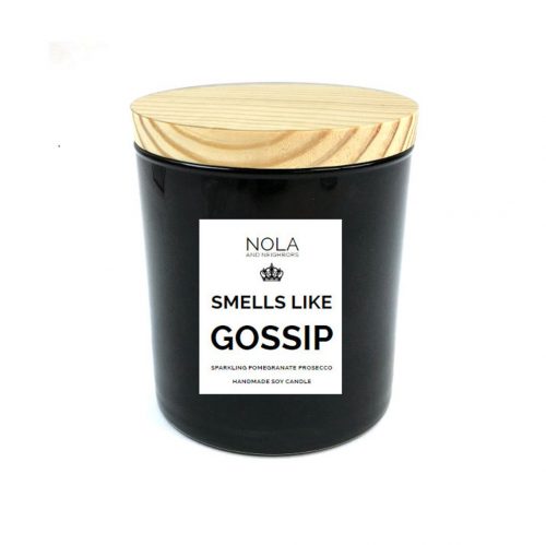 A candle in a black matte jar with a light wooden lid. 