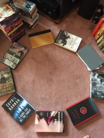 A shot from above of a ring of nine hardcover books