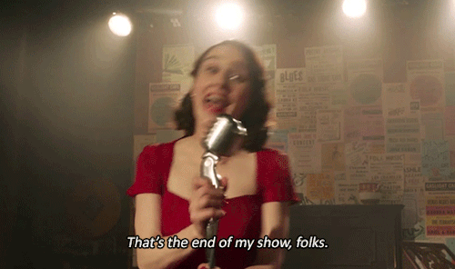 A VERY IRRITATED Midge talking into the mic and saying That's the end of my show, folks. (she's about to get arrested for the second time in two days for swearing on stage.)