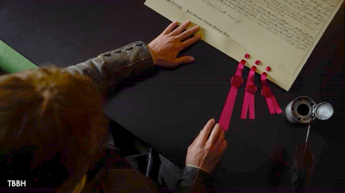 DOCUMENT PORN. Jamie pulls the land grant to him. It's a large parchment with calligraphy and ribbons and seals an a uneven top edge.