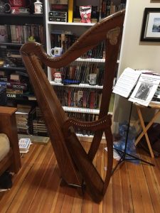 Raynelle, a 36 string harp, posed with her little sister, Mignonette, a 19 string harp.